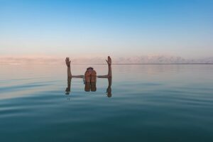 a person floating in the dead sea