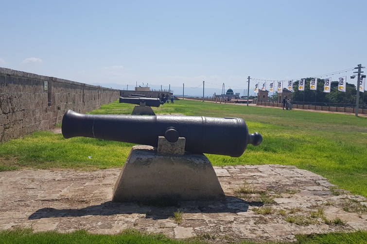 old cannon on acre walls