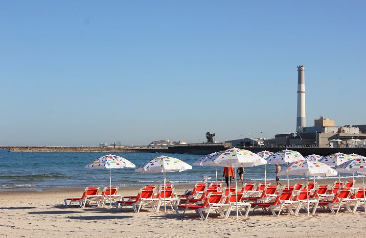 chairs and umbrellas at metzitzim beach in tel aviv