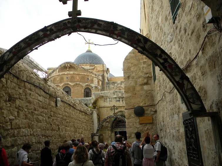 tourists walking the via dolorosa in jerusalem